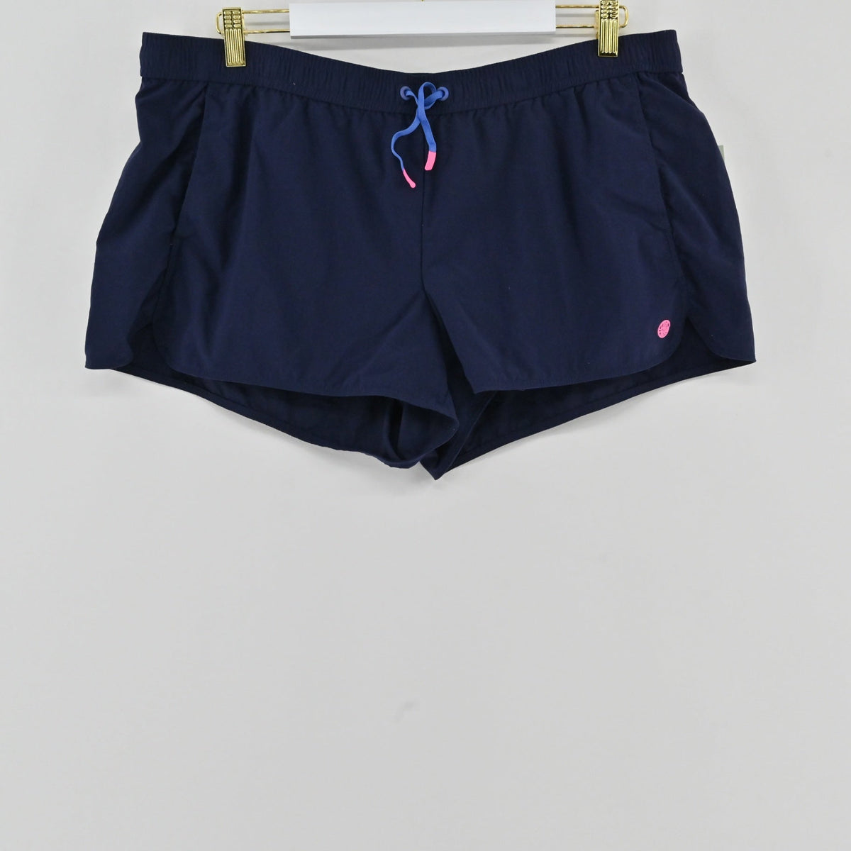 Lynn's Closet Boutique navy blue Lilly Pulitzer Luxletic athletic shorts with drawstring and pink logo detail.