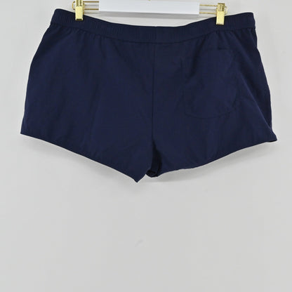 Lynn's Closet Boutique Lilly Pulitzer navy blue Luxletic athletic shorts with a back pocket hanging on a hanger