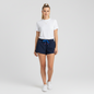Model wearing Lynn's Closet Boutique Lilly Pulitzer navy blue Luxletic shorts with a white t-shirt and sneakers