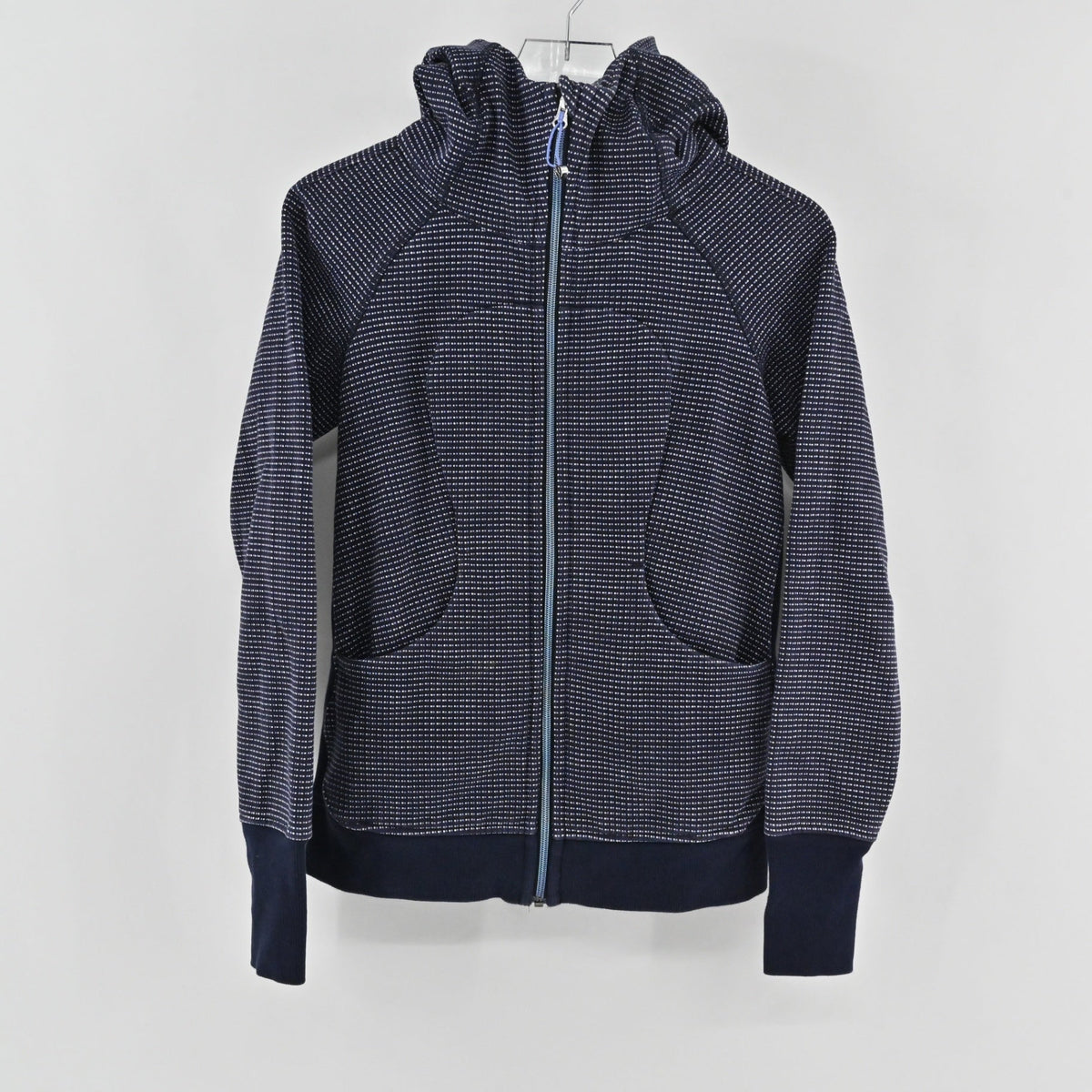 Lynn's Closet Boutique navy blue Lululemon full-zip hoodie with a white dotted pattern, high neck, and ribbed cuffs.