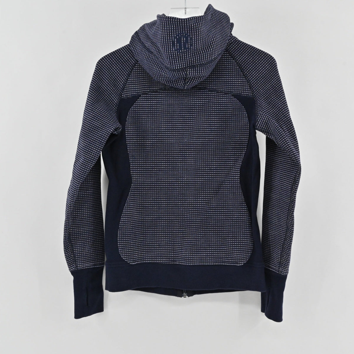 Lynn's Closet Boutique Lululemon navy blue full-zip hoodie with a white dotted pattern and hood logo detail