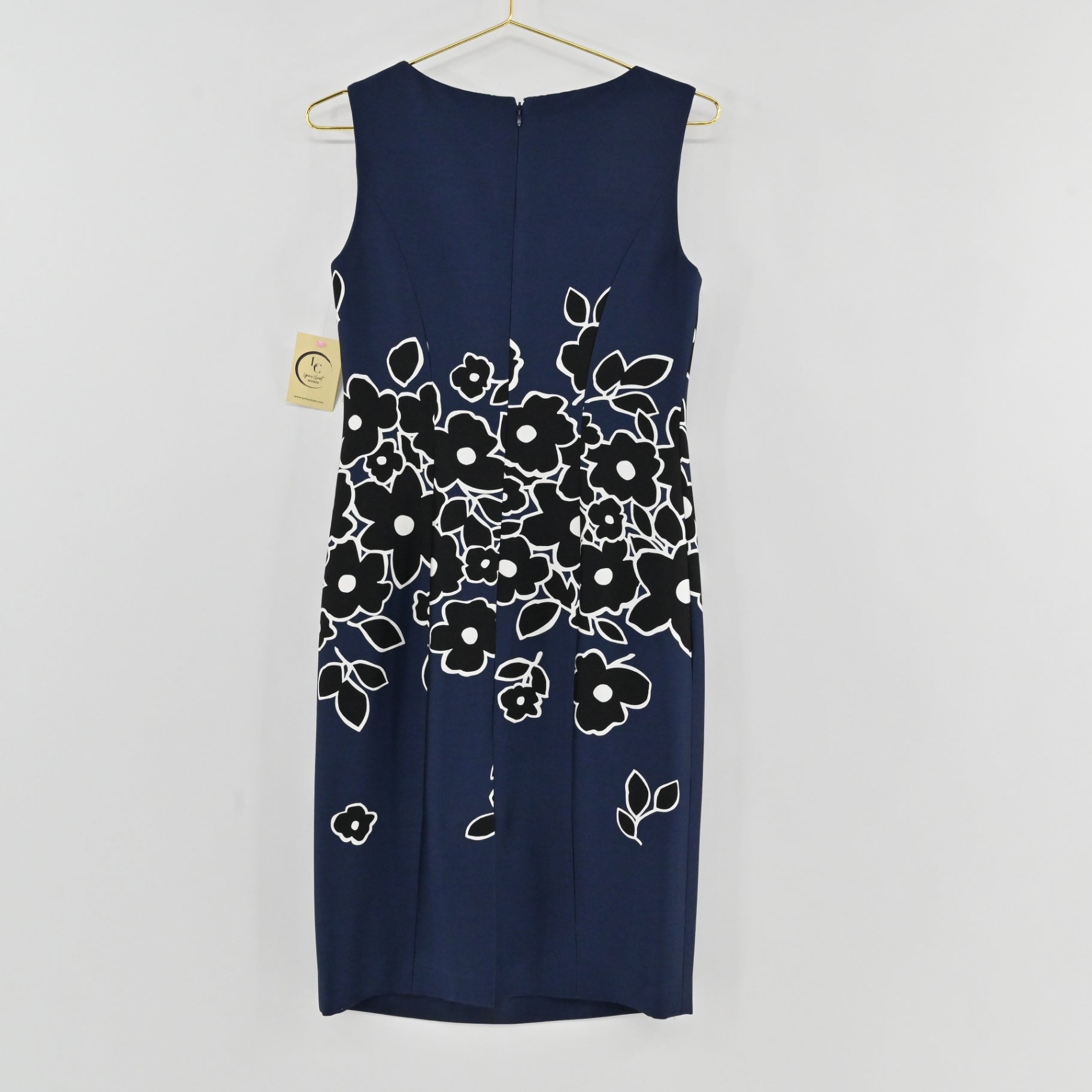 Lynn's Closet Boutique Carolina Herrera navy blue sheath dress with black and white floral print, sleeveless design