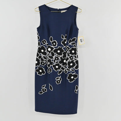 Lynn's Closet Boutique Carolina Herrera navy blue sheath dress with black and white floral print on a gold hanger