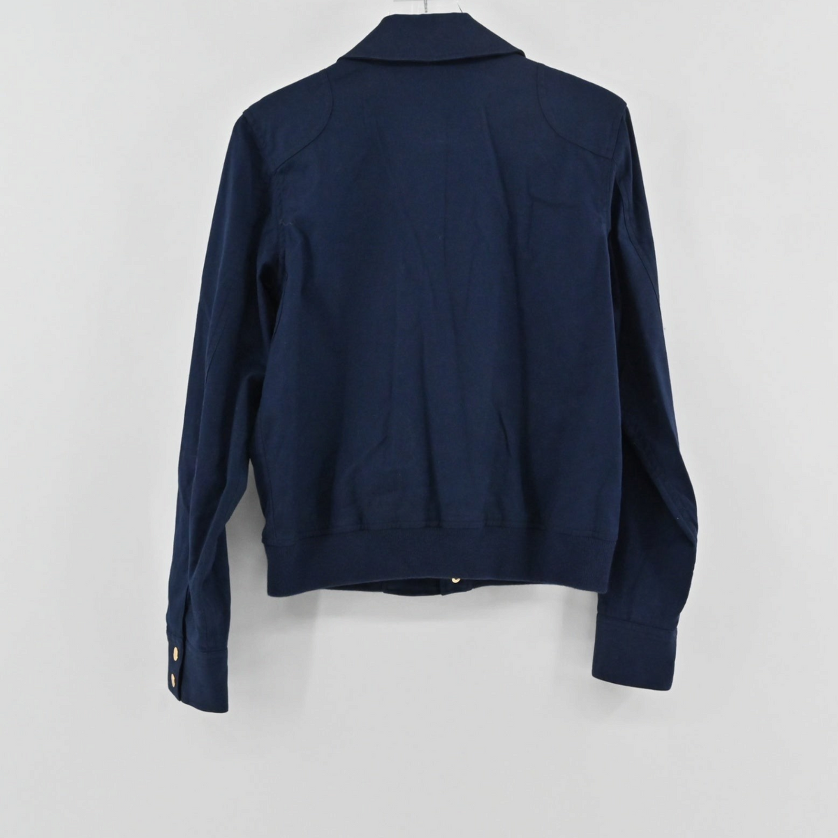 Back view of a Lynn's Closet Boutique navy jacket with a structured collar and long sleeves on a white background.