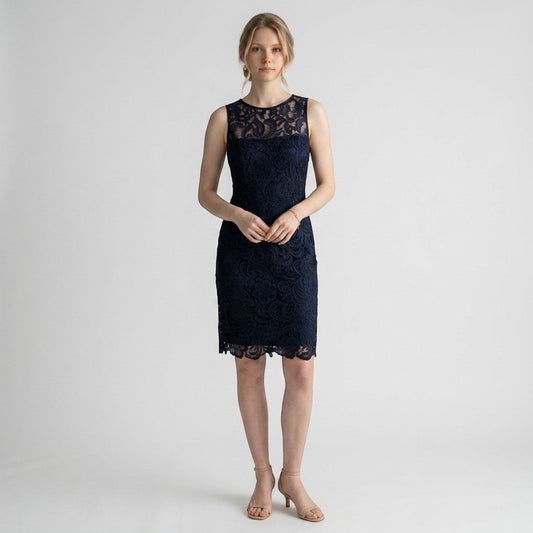 Model wearing a navy blue Adrianna Papell lace sheath dress with a sleeveless design from Lynn's Closet Boutique