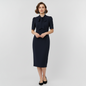 Model wearing a Lynn's Closet Boutique navy midi sheath dress with short sleeves and a high tie-neck detail.