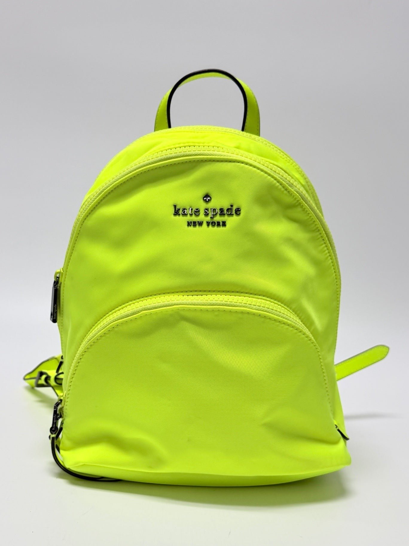 Lynn's Closet Boutique neon yellow Kate Spade Chelsea nylon backpack with front zippered pocket and logo detail.