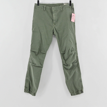 Lynn's Closet Boutique Nili Lotan olive green slim-fit pants with side-zip ankles and back flap pockets.