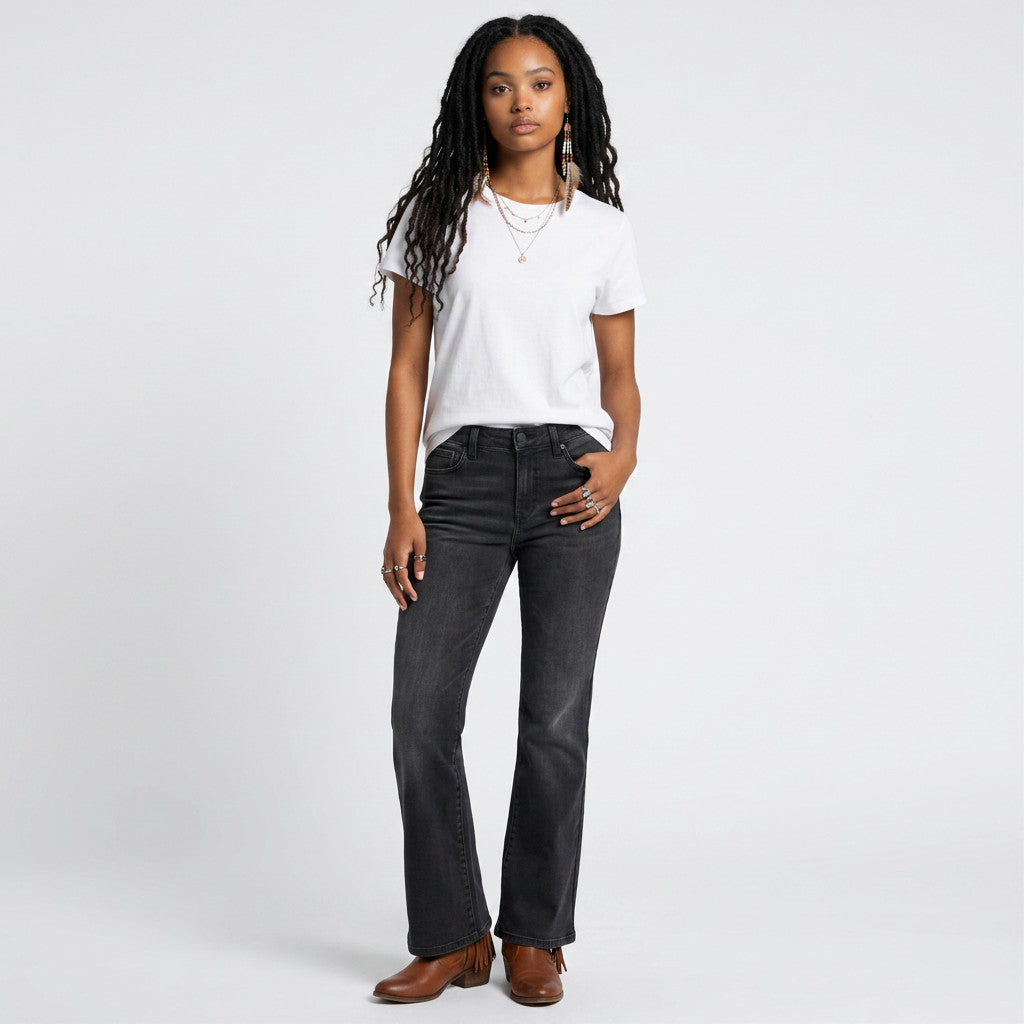 Lynn's Closet Boutique model wearing NYDJ Ava flare charcoal jeans with a white t-shirt and brown boots