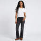 Lynn's Closet Boutique model wearing NYDJ Ava flare charcoal jeans with a white t-shirt and brown boots