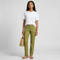 Model wearing Lynn's Closet Boutique Agnona olive green straight leg pants with a white t-shirt and straw bag
