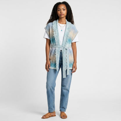 Model wearing a Lynn's Closet Boutique blue and beige ombre belted cardigan with fringe trim over a white t-shirt.