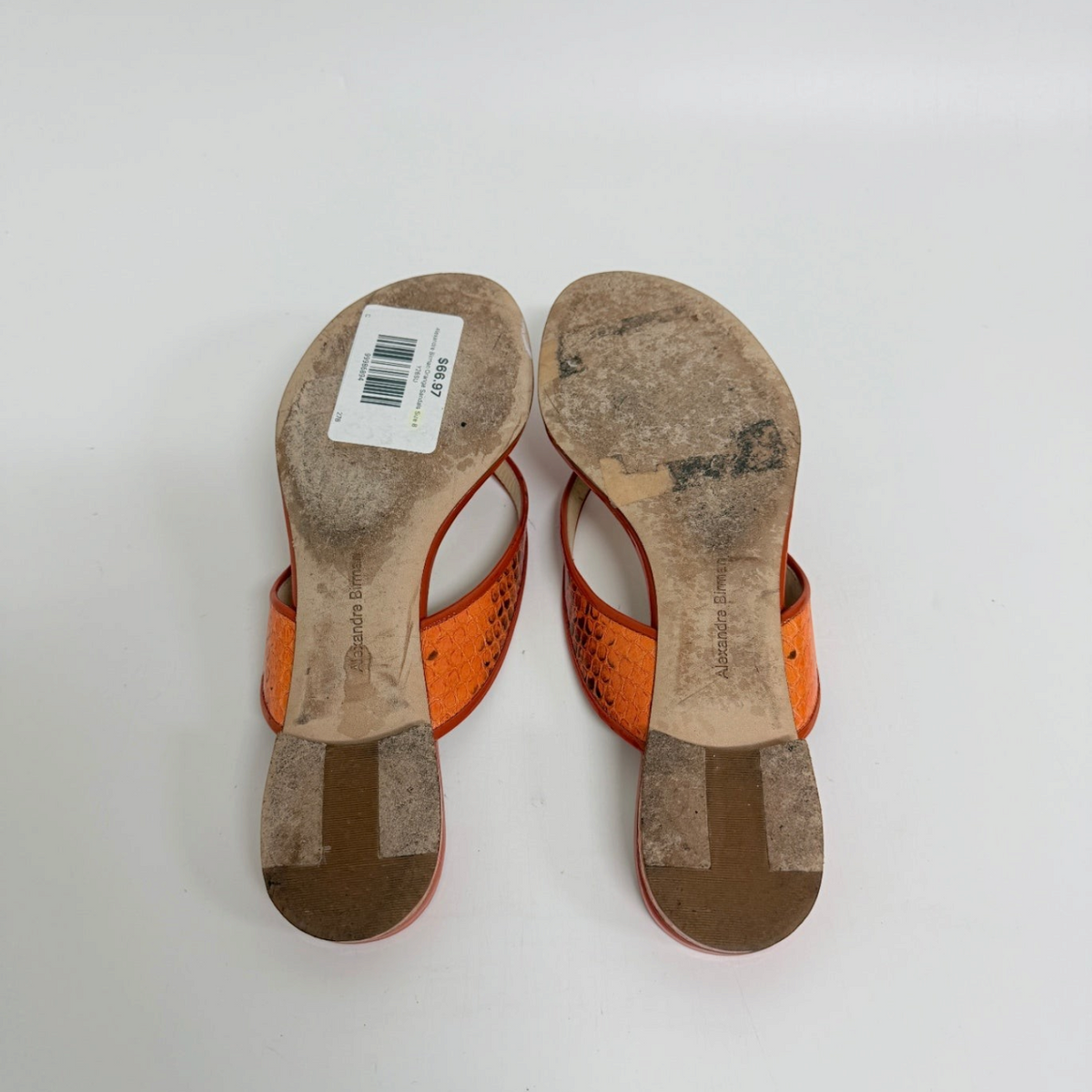 Lynn's Closet Boutique Alexandre Birman orange snakeskin-embossed thong sandals, bottom view showing soles.