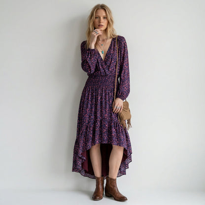 Lynn's Closet Boutique Parker abstract print midi dress with long sleeves, v-neck, and high-low hem on a blonde model
