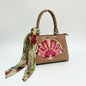 Lynn's Closet Boutique Patricia Nash Angela satchel in camel leather with a seashell graphic and floral scarf accent