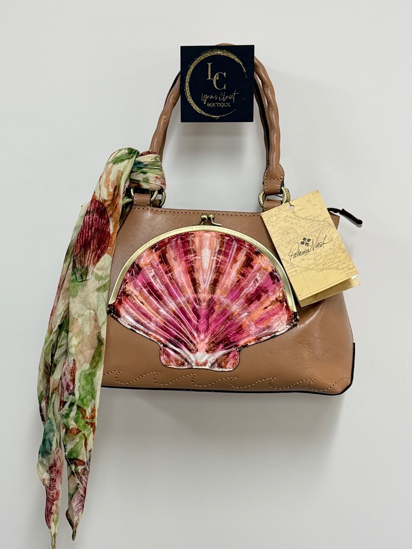Lynn's Closet Boutique Patricia Nash Angela satchel in camel leather with a vibrant seashell embellishment and scarf.