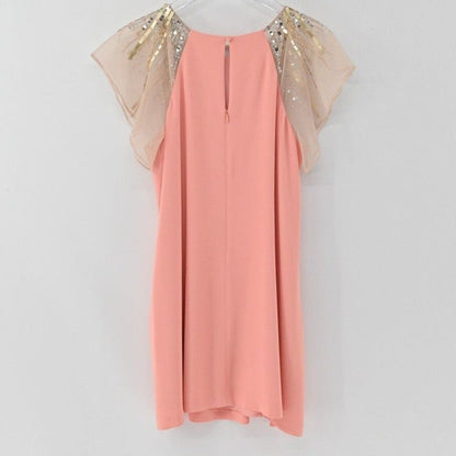 Lynn's Closet Boutique peach shift dress with sheer flutter sleeves and metallic beaded shoulders, back view.