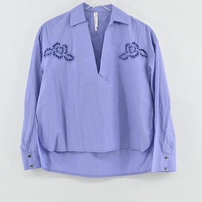 Lynn's Closet Boutique periwinkle purple Anthropologie popover blouse with eyelet embroidery and a V-neckline.