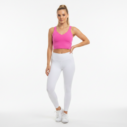 Model wearing a pink Lululemon Align tank top and white leggings from Lynn's Closet Boutique