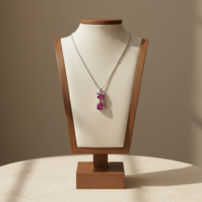 Lynn's Closet Boutique cat pendant necklace featuring a bright pink zirconia stone on a fine silver-tone chain.