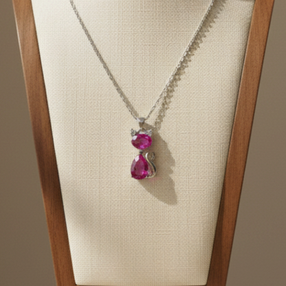 Lynn's Closet Boutique cat pendant necklace featuring bright pink zirconia stones on a fine sterling silver chain.