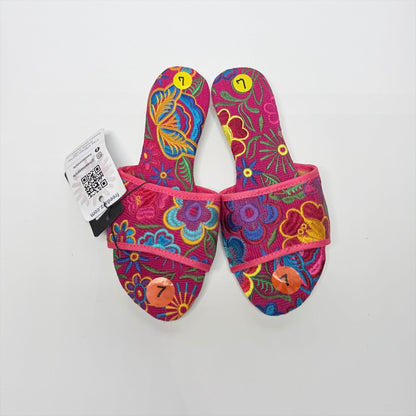 Lynn's Closet Boutique FreeDazz pink slides with vibrant multi-colored floral embroidery and size 7 stickers attached.