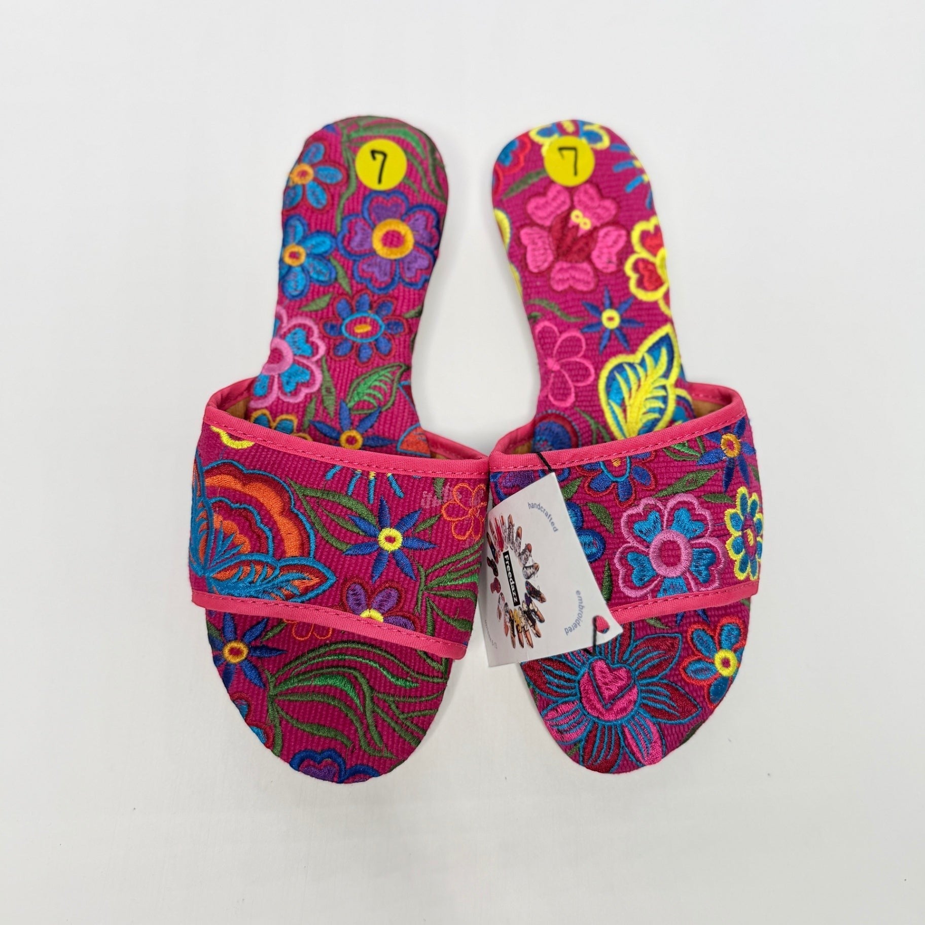 Lynn's Closet Boutique FreeDazz pink slides with vibrant multi-colored floral embroidery and size 7 stickers