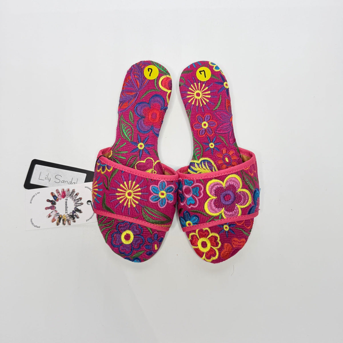 Lynn's Closet Boutique FreeDazz pink fabric slides with vibrant multi-colored floral embroidery and size 7 tags