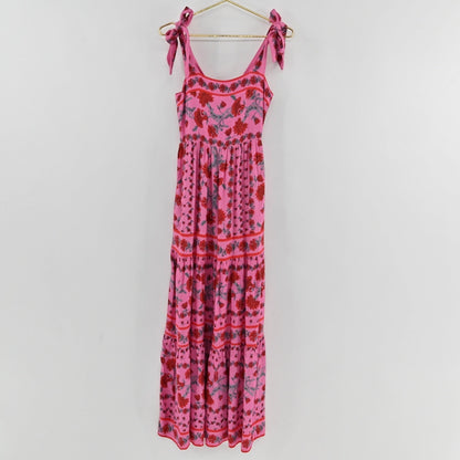 Lynn's Closet Boutique Beach Riot pink floral maxi dress with square neckline, tie straps, and tiered skirt.
