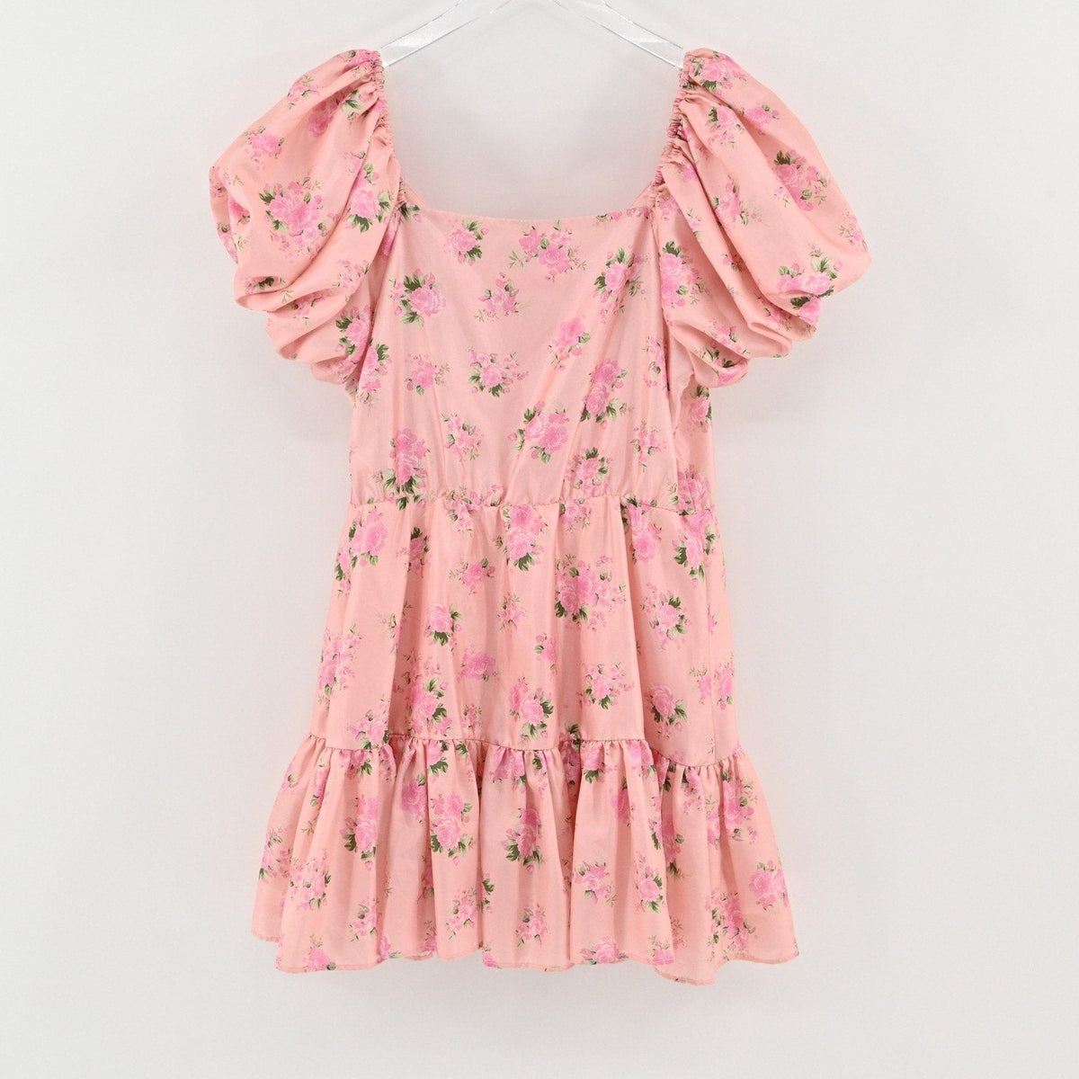 Lynn's Closet Boutique pink floral mini dress with puff sleeves, square neckline, and tiered ruffled skirt.