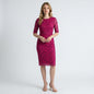 Model wearing a Lynn's Closet Boutique Monique Lhuillier pink lace sheath dress with elbow-length sleeves
