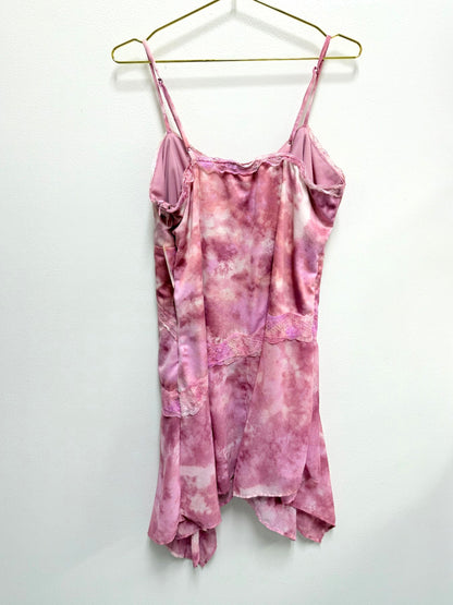 Lynn's Closet Boutique Wild Fable pink tie-dye asymmetrical dress with lace trim and spaghetti straps on a hanger