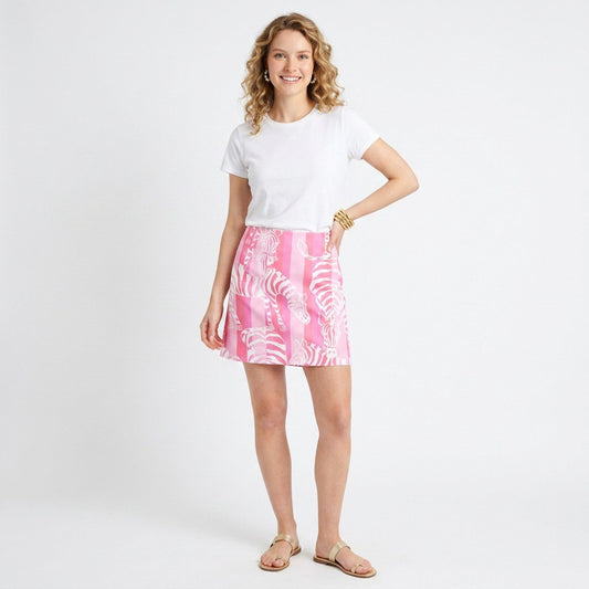 Lynn's Closet Boutique Lilly Pulitzer reversible pink and white zebra print skirt worn by a model with a white tee