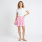 Lynn's Closet Boutique Lilly Pulitzer reversible pink and white zebra print skirt worn by a model with a white tee