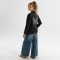 Model wearing a Lynn's Closet Boutique Hipchik Couture charcoal pinstripe blazer with a crystal butterfly back design