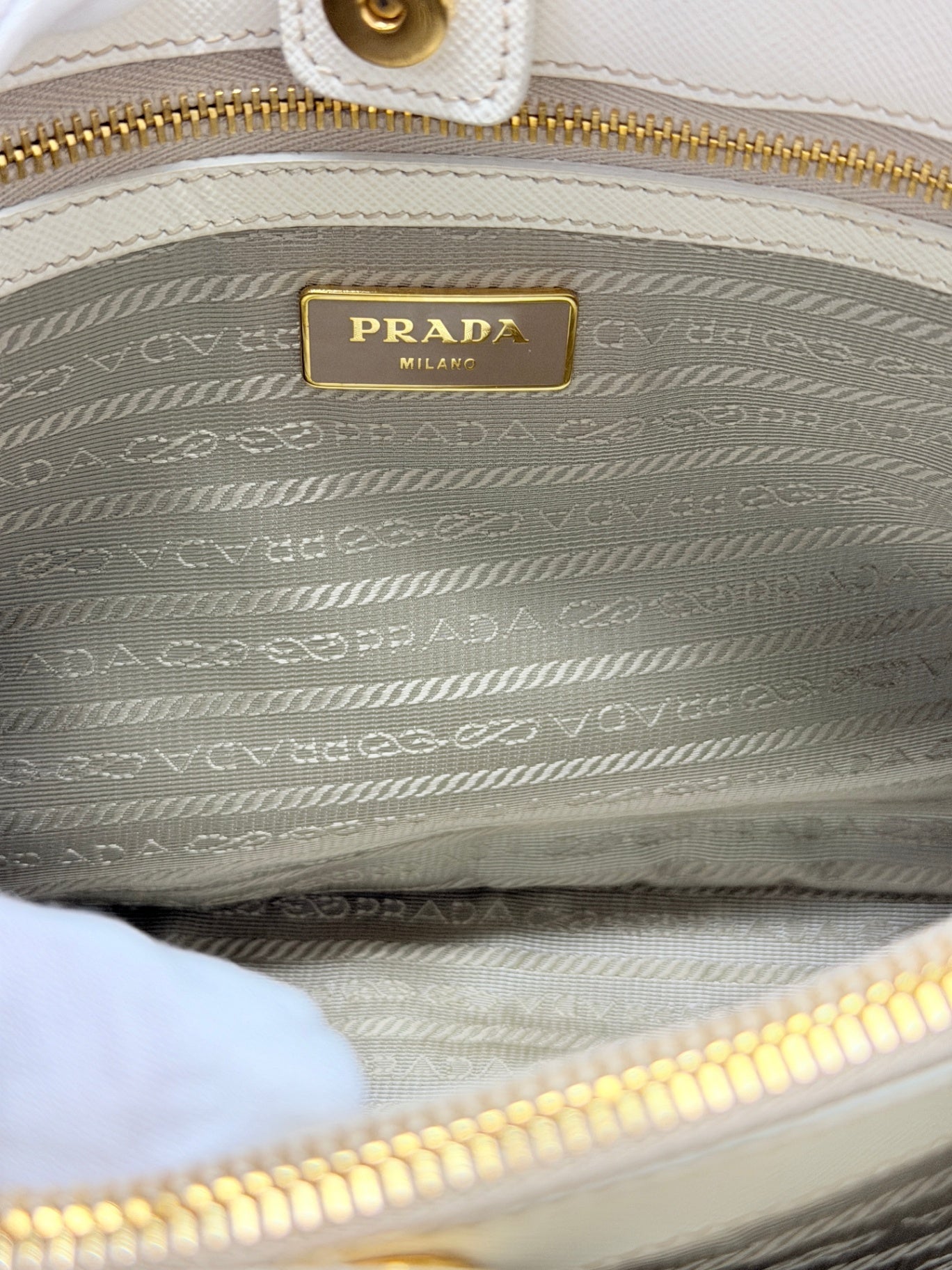 Lynn's Closet Boutique Prada Galleria handbag interior featuring signature logo plaque and branded fabric lining