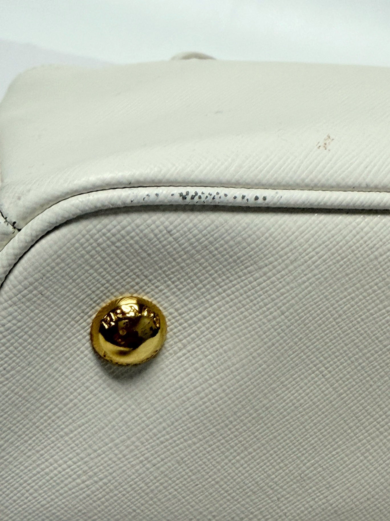Lynn's Closet Boutique Prada Galleria white Saffiano leather handbag base showing gold protective feet and wear