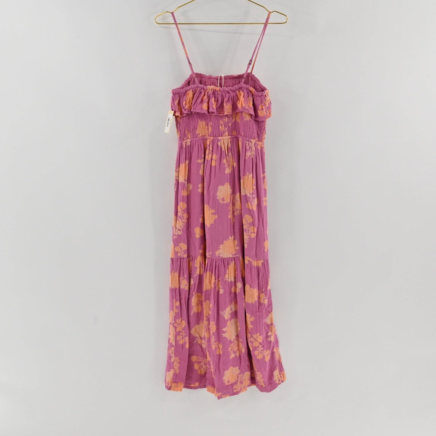 Lynn's Closet Boutique Z Supply purple midi dress with orange floral print, smocked bodice, and ruffled neckline.