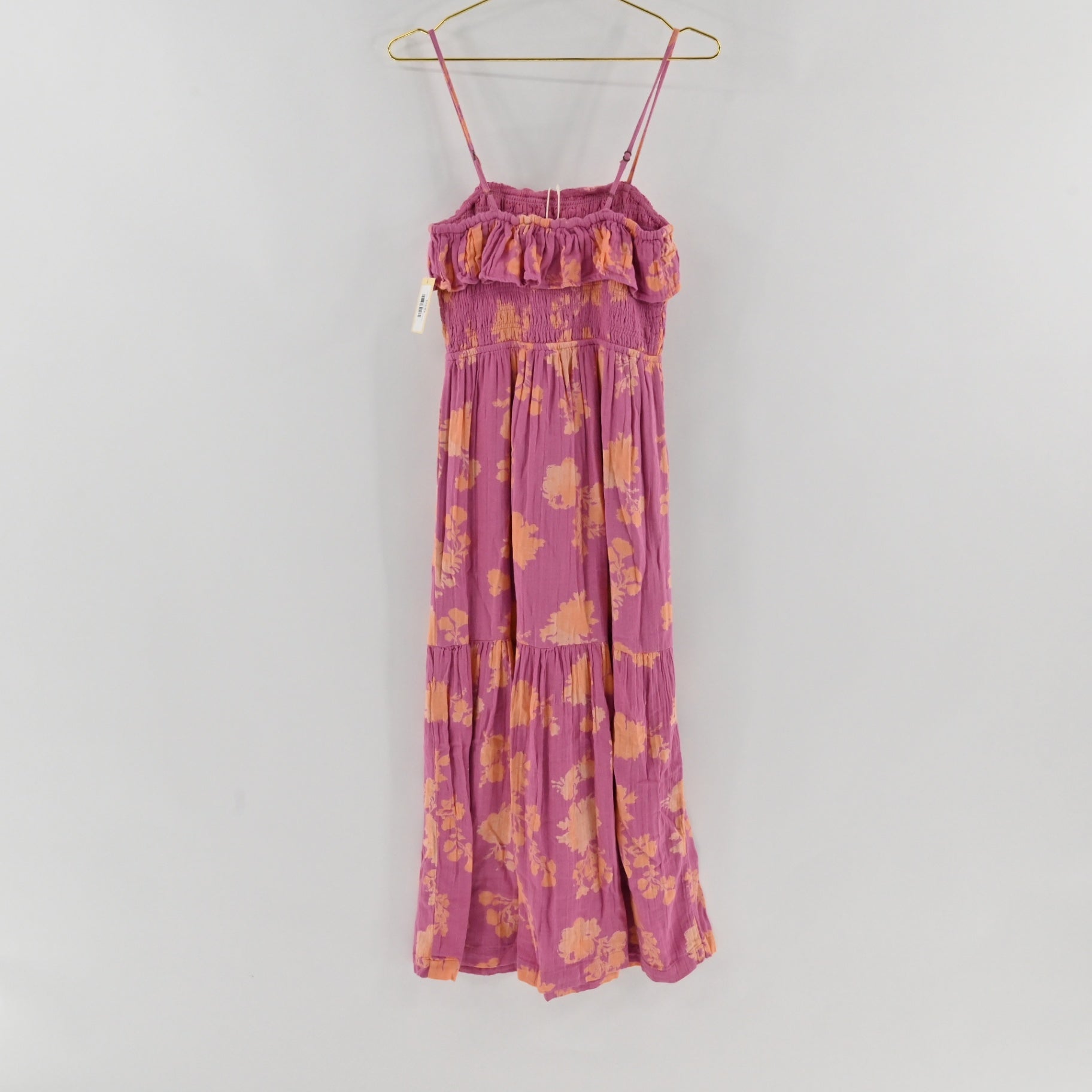 Lynn's Closet Boutique Z Supply purple midi dress with orange floral print, smocked bodice, and ruffled neckline.