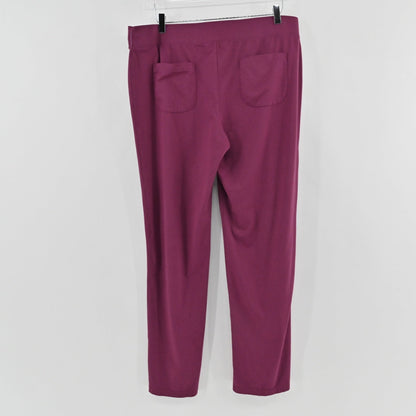 Lynn's Closet Boutique purple Lilly Pulitzer leggings featuring back pockets, shown from the back on a hanger.