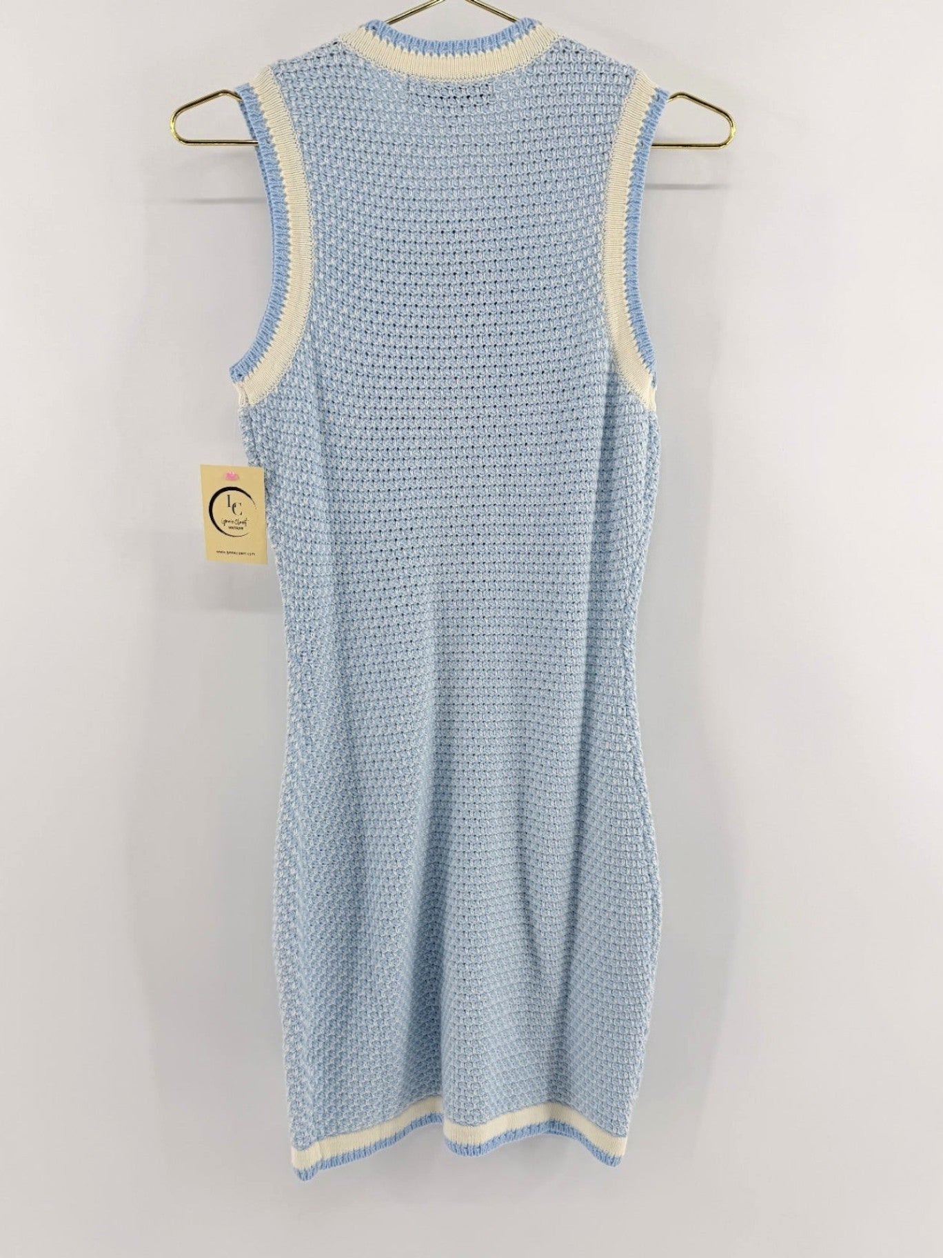 Lynn's Closet Boutique Rachel Parcell sleeveless baby blue textured knit dress with cream trim on a hanger