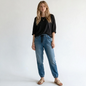 Model wearing Lynn's Closet Boutique Rag & Bone medium-wash denim joggers with elastic waistband and cuffs