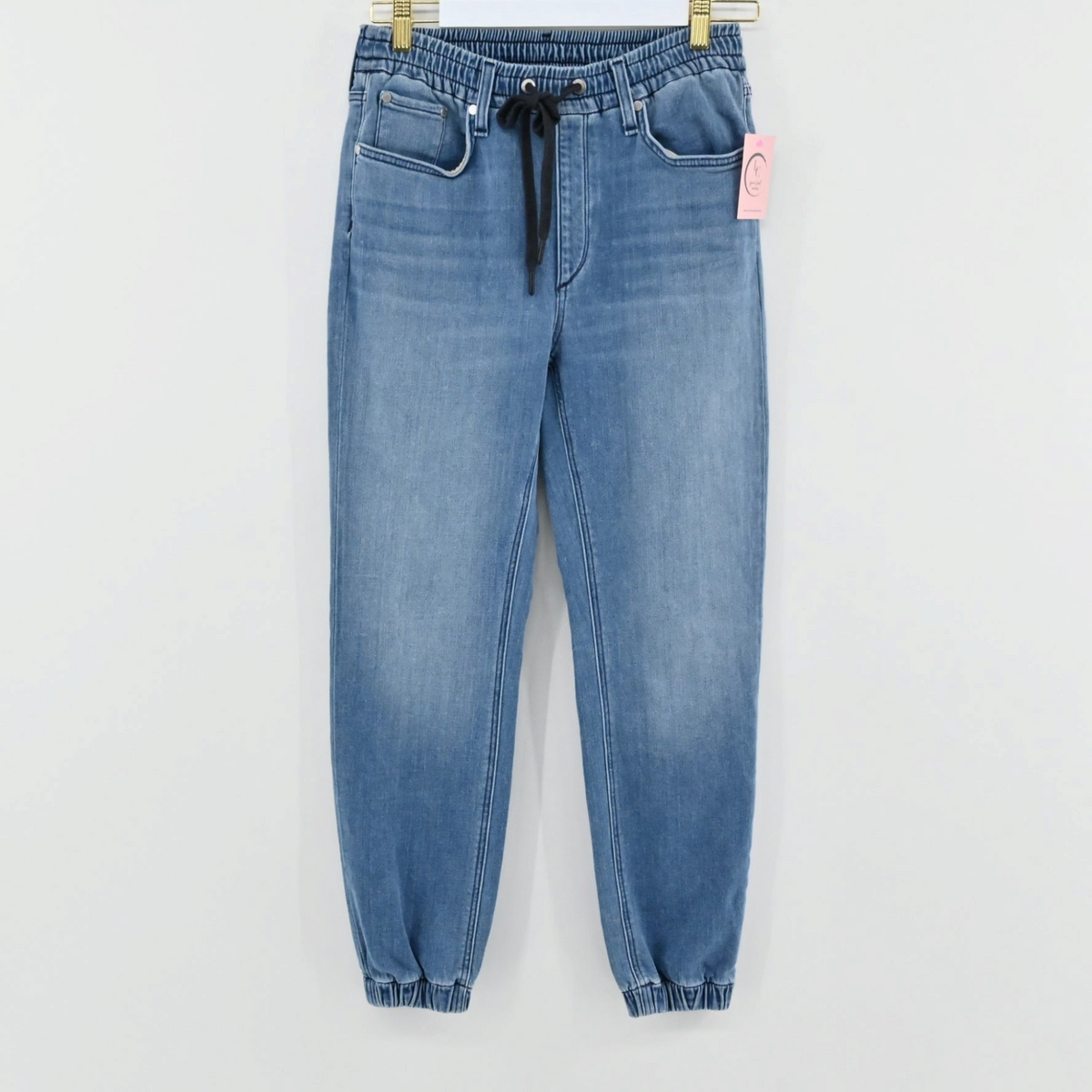 Lynn's Closet Boutique Rag & Bone medium-wash blue denim joggers with elastic waistband, drawstring, and cuffed ankles.