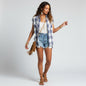 Model wearing a Lynn's Closet Boutique Rails Britt plaid sleeveless button-down shirt with denim shorts