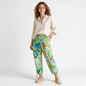 Model wearing Lynn's Closet Boutique Ralph Lauren floral silk cargo pants with drawstring waist and tie-cuff hems.