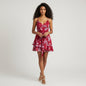 Lynn's Closet Boutique red floral print tiered mini romper with spaghetti straps and tie waist. Size XXS.