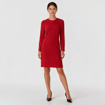 Model wearing a red Ralph Lauren Black Label long sleeve shift dress from Lynn's Closet Boutique with black heels.