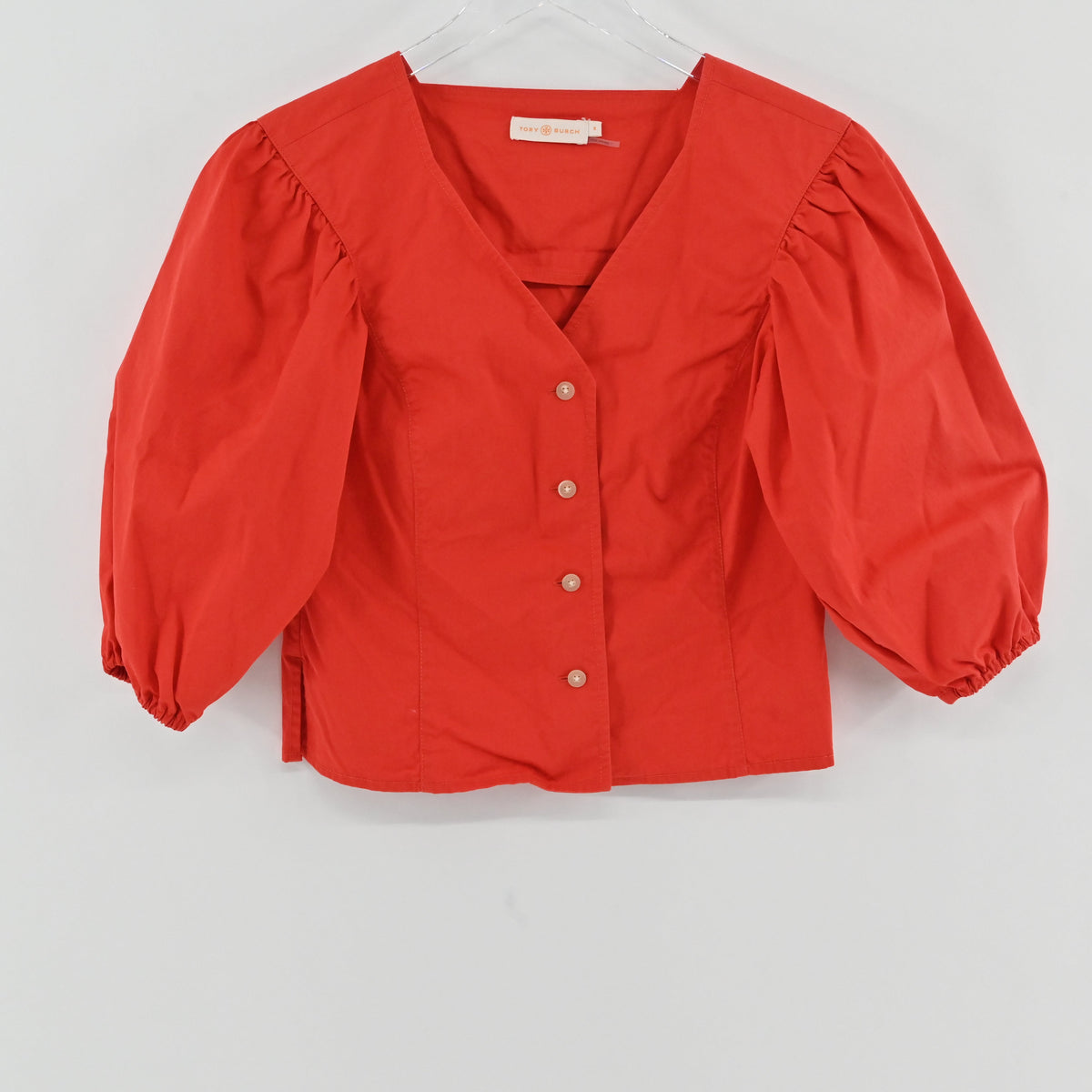 Lynn's Closet Boutique red Tory Burch cotton poplin cropped top with V-neck and dramatic puff sleeves.