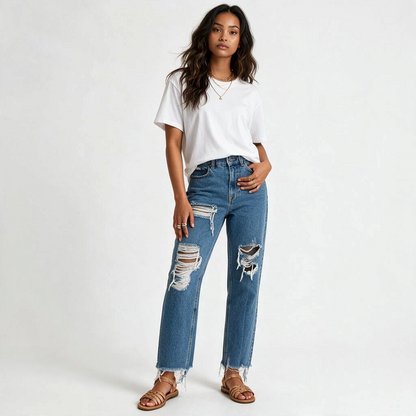 Model wearing Lynn's Closet Boutique Retrofête medium-blue high-rise distressed straight-leg jeans with frayed hem