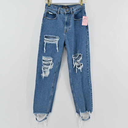 Lynn's Closet Boutique Retrofête medium-blue high-rise distressed denim jeans with frayed raw hem and knee rips.